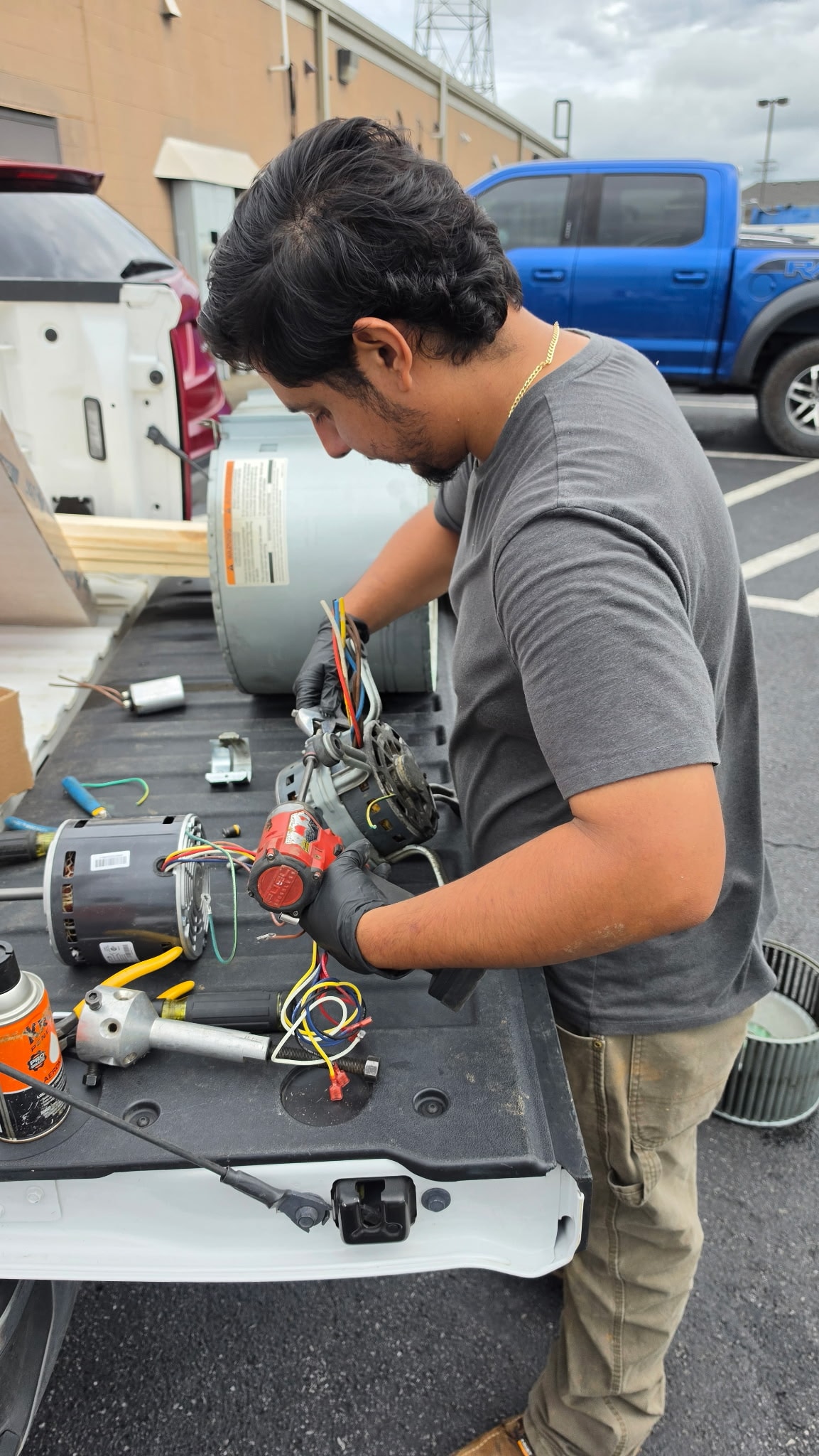 TrueCore Mechanical technician servicing a commercial HVAC unit